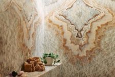 a fantastic shower space fully done with agate walls, floor and even a bench leaves a lasting impression
