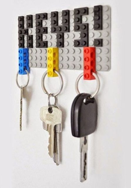 a Lego-inspired key rack with colorful details and keys that are attached using Lego details