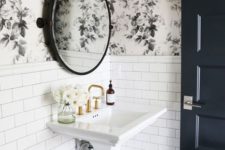 black and white floral wallpaper with white tiles create a bold and chic look