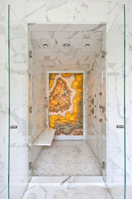 a marble shower and steam room and a bold accent agate wall in a contrasting color