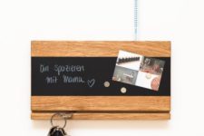 05 a modern key rack with a fissure for holding keys, a chalkboard magnet board for leaving messages