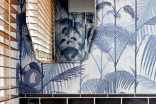 05 black tiles plus tropical leaf print wallpaper in grey shades create a bold tropical ambience