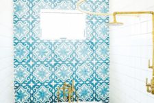 10 a wall and floor clad with bold turquoise patterned Moroccan tiles for a gorgoeus look