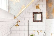 11 a grey and white bathroom with gold detailing and grey and gold fish print wallpaper