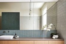 11 very small blue tiles for the bathroom backsplash add a texture and an interesting touch