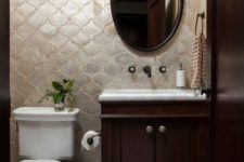 Moroccan tiles of a tender pearly shade accentuate this small powder room