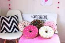 14 colorful donut pillows will brighten up any room and both adults and kids will like them