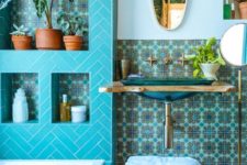15 the turquoise space is accented with bold patterned tiles in the niches and on the wall