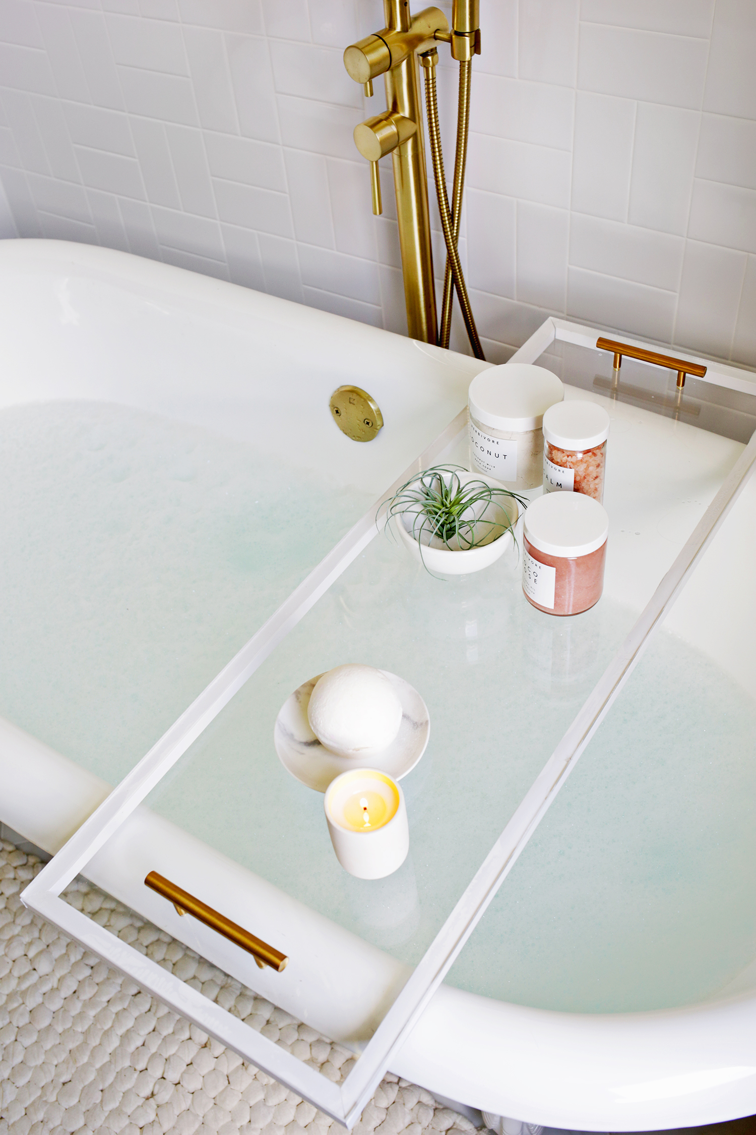 DIY lucite bathtub caddy or tray (via abeautifulmess.com)