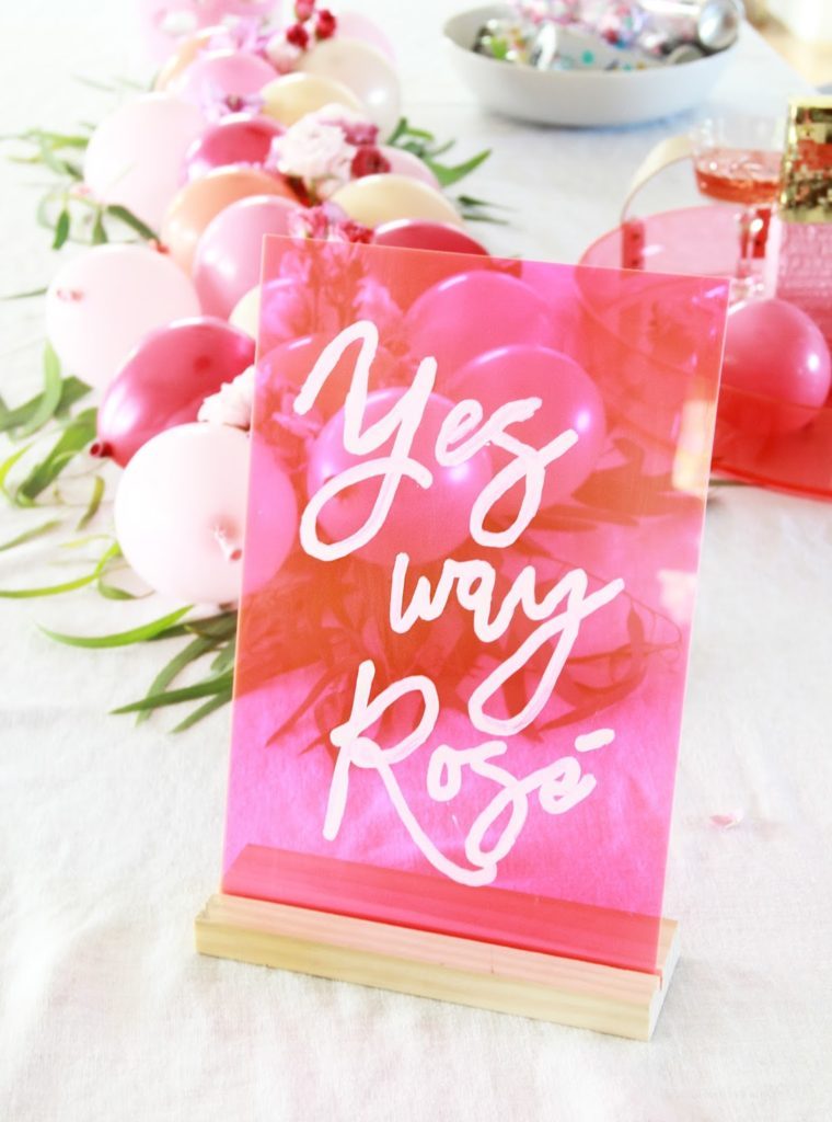 DIY pink acrylic signs for a party (via abubblylife.com)