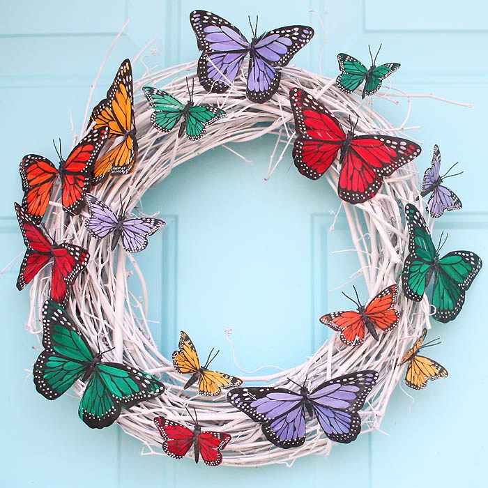 DIY white grapevine butterfly wreath (via gina-michele.com)