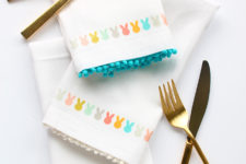 DIY colorful Easter bunny napkins with pompom trim