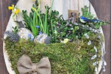 DIY Easter wall art of a moss basket and flowers