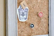 DIY weathered shutter organizer with a chalkboard and a pinboard