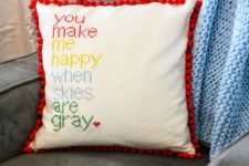 DIY cross stitched pillows with pompoms