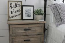 05 a light-colored plywood Rast nightstand with black handles for a vintage farmhouse space