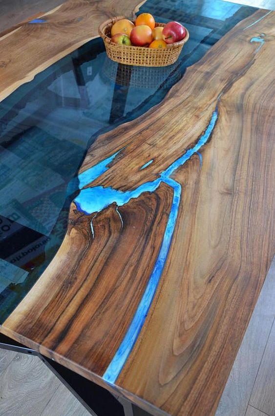 live edge river inspired dining table with blue resin looks very interesting