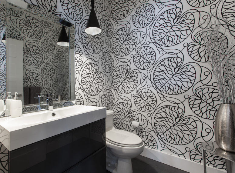 printed black and white wallpaper is a chic and trendy idea for a bathroom or a powder room