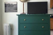 13 an elegant emerald green Rast dresser with gold knobs is a chic idea