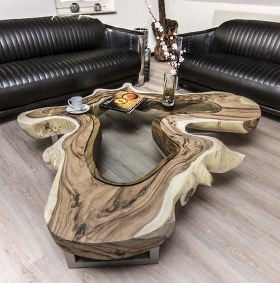 a unique wood and resin coffeee table is a show stopper in this living room