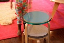 24 a cool side table with two tiers, cork tops and a glass one made of two IKEA Frosta stools