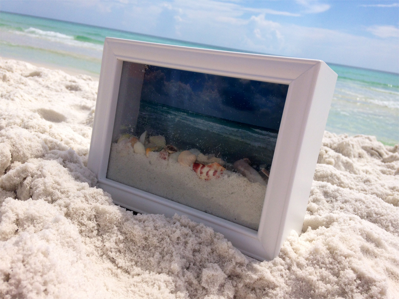 DIY ocean view shadow box with sand and shells