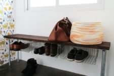 DIY wooden bench with metal baskets for shoe storage