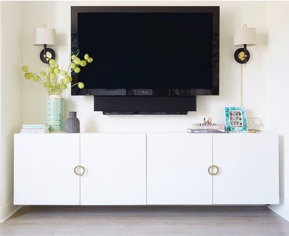 a chic floating media console made of an IKEA Besta piece and stylish round pulls