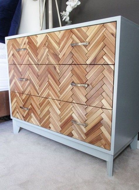 IKEA Hemnes dresser fully clad with wood in a chevron pattern and with metal handles