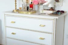 08 a white Hemnes piece spruced up with decorative nails and brass handles for a shiny glam look