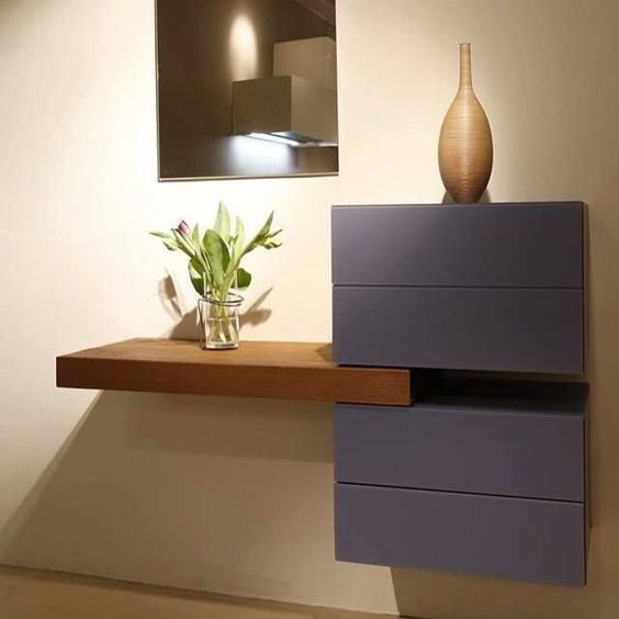 a stylish entryway floating console table made of an IKEA Besta unit and a stained Lack shelf