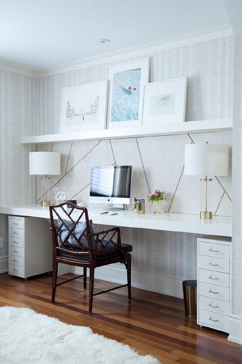 IKEA Lack shelves for displaying art and as a floating desk, additional cabinets under the top