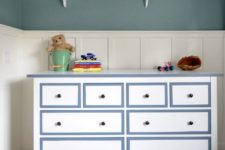 19 a white Hemnes dresser with powder blue frames and black knobs for a boy’s room