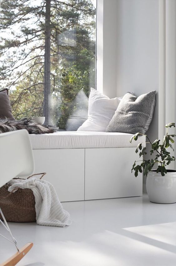 IKEA Besta bench with storage and upholstery plus pillows as a windowsill nook