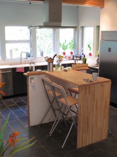 DIY kitchen island of IKEA Lagan tops (via www.shelterness.com)