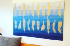 DIY ombre blue artwork with gold stenciled feathers