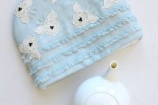 DIY blue tea cozy with lace and bead appliques