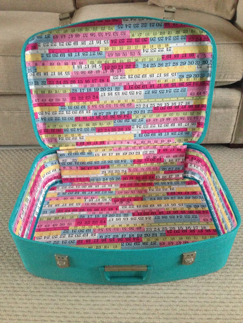 DIY liner of colorful ribbons for a vintage suitcase (via hellohooray.com)
