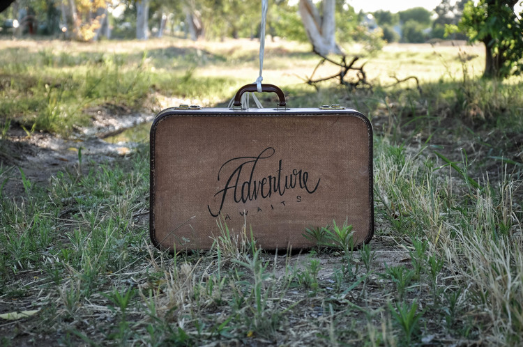 DIY stenciled vintage suitcase with letters (via www.thecopperanchor.com)