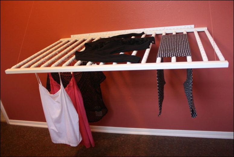 DIY wall-mounted drying rack of an old crib (via youcancallmegwen.typepad.com)