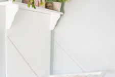 DIY laundry rack with a shelf on top