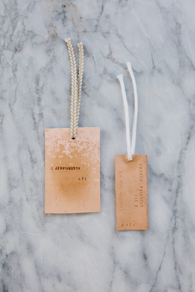 DIY whitewashed and stamped luggage tags with ribbons (via theeffortlesschic.com)