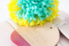 DIY paint dipped leather tags with colorful pompoms