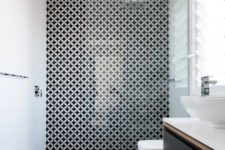 11 a monochromatic space with mosaic tiles in the shower zone for a stylish accent