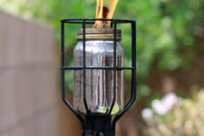 DIY industrial tiki torch of a metal bulb cage
