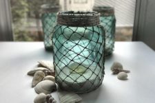 DIY turquoise luminaries with decorative netting