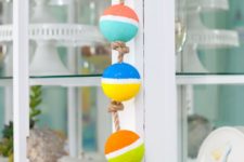 DIY colorful buoy garland of foam balls and rope