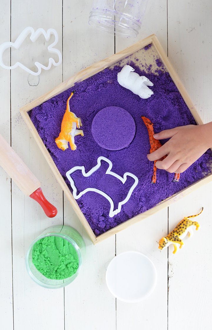 DIY purple kinetic sand of colored sand and cornstarch