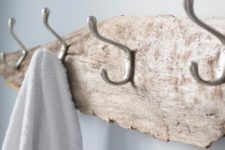 DIY driftwood towel rack for a coastal feel