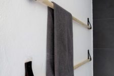 DIY minimalist towel rack of wood and black leather